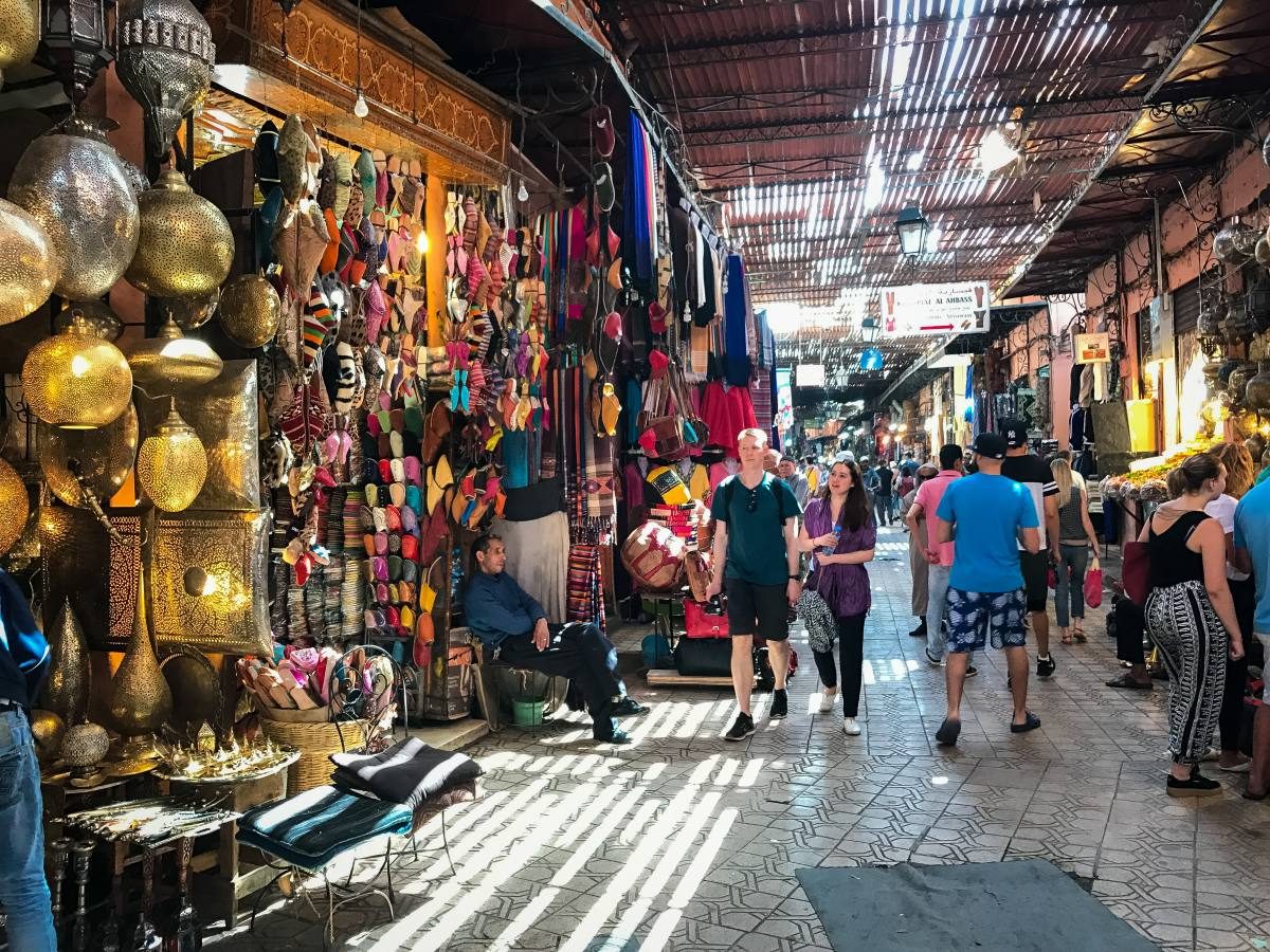 Busy souk streets of Marrakech filled with traditional crafts, an essential experience recommended by all Marrakech travel tips.