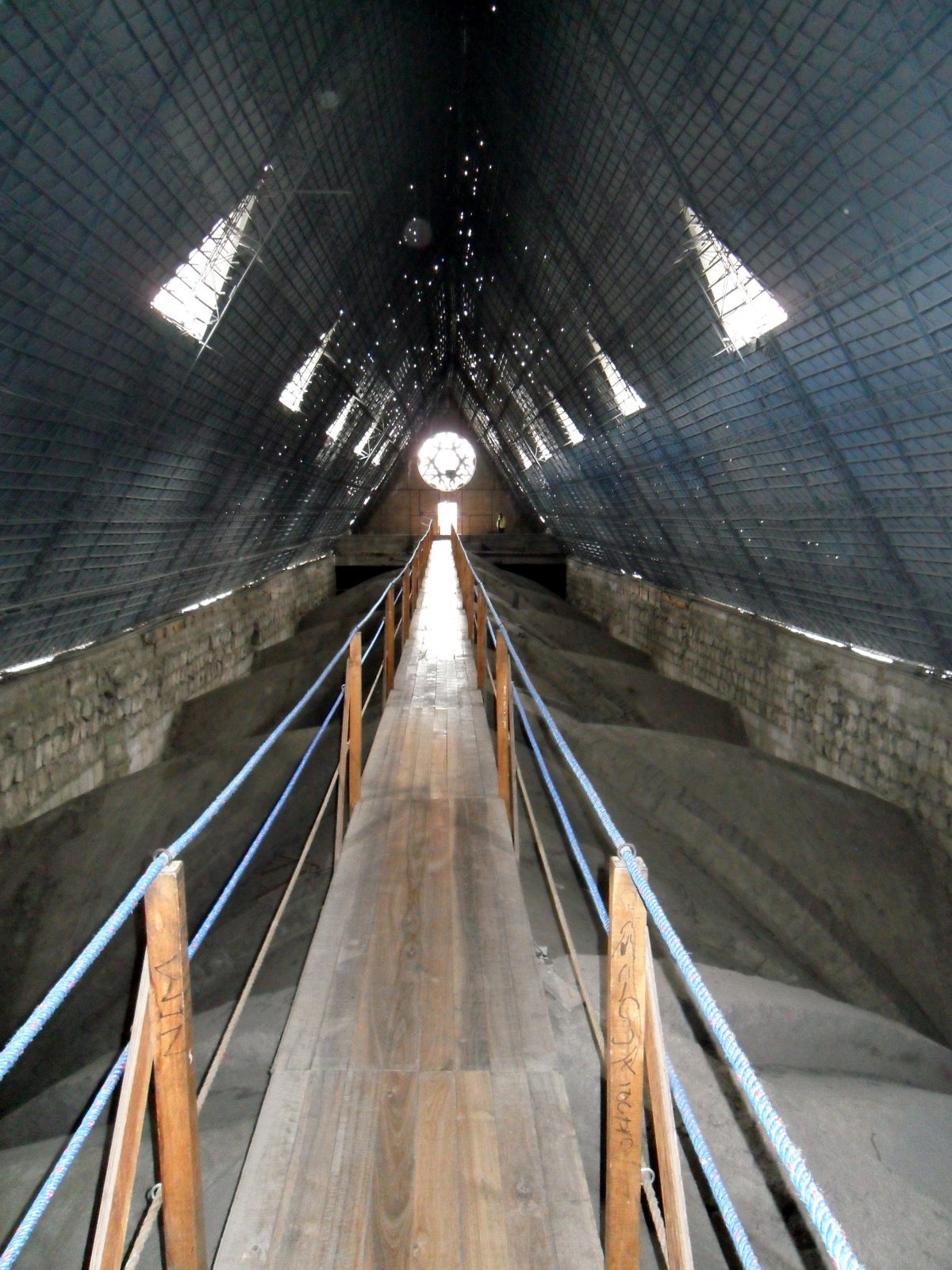 A bridge across the interior arches of the Basilica del Voto Nacional in Quitos.