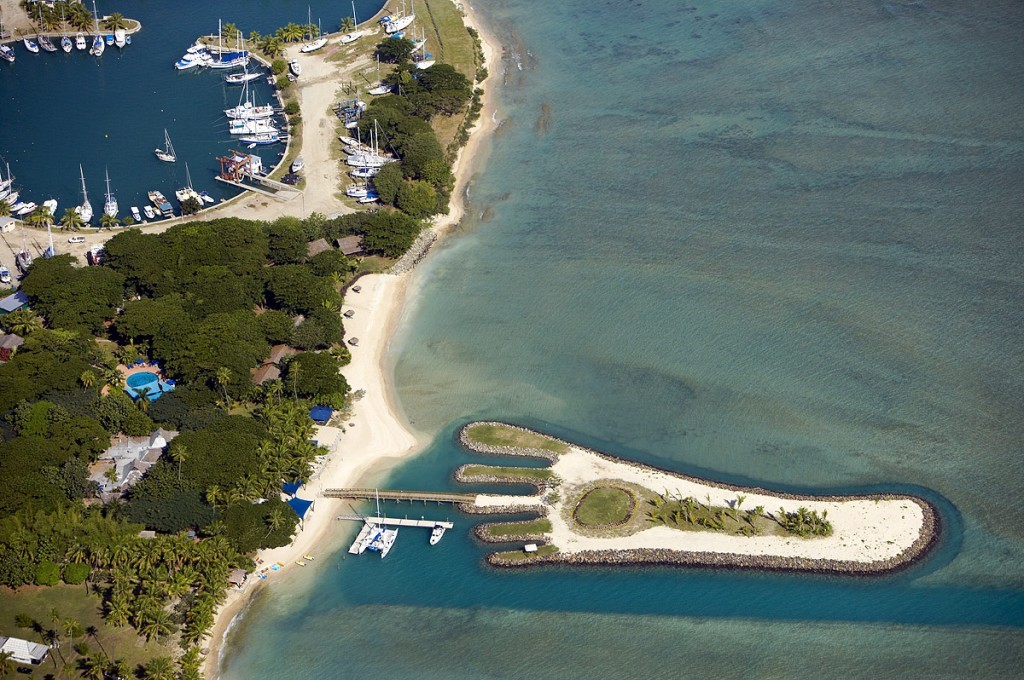 Aerial view of an island that looks like a foot taken while skydiving one of the many Fiji activities for tourists