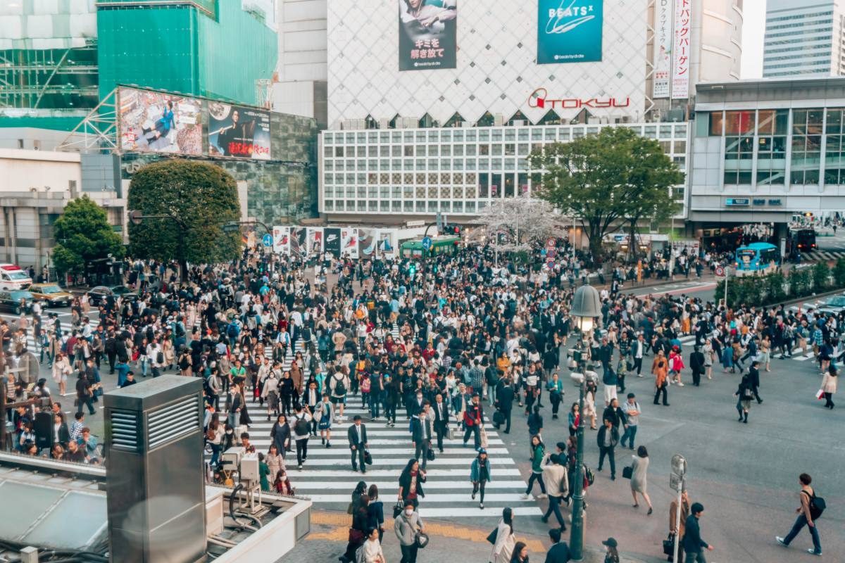 Crowds crossing the famous Shibuya Scramble, a Tokyo experience not to be missed.
