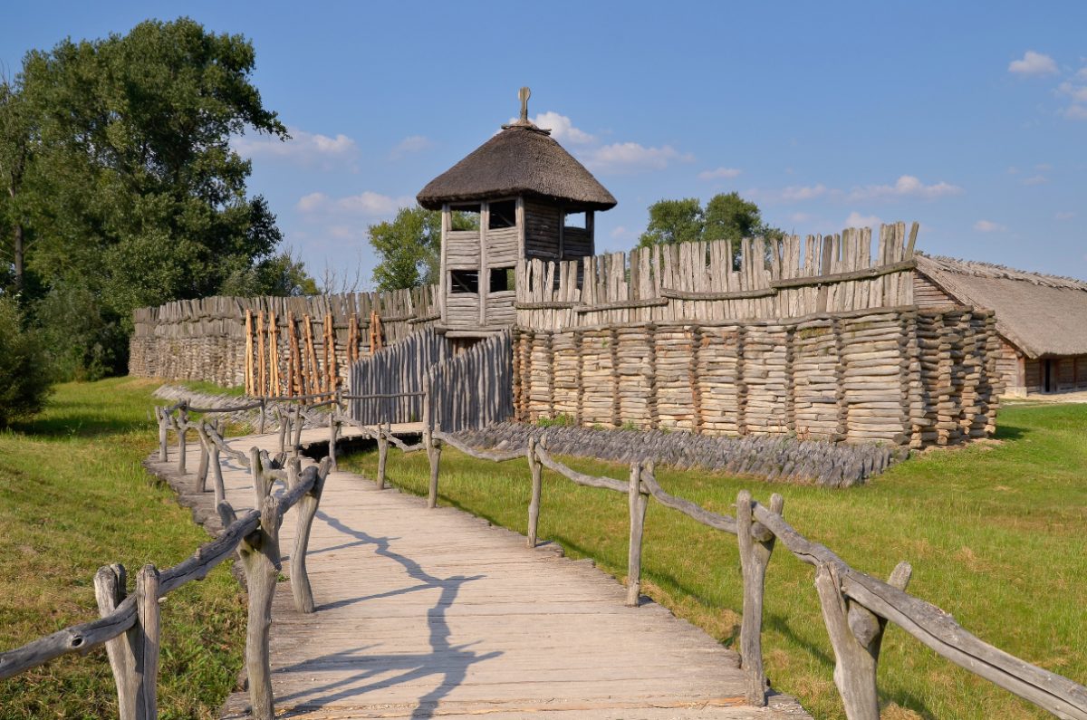 Biskupin Poland A reconstructed wooden fortification in Poland evoking the early medieval settlements with its rustic palisade walls and watchtower.