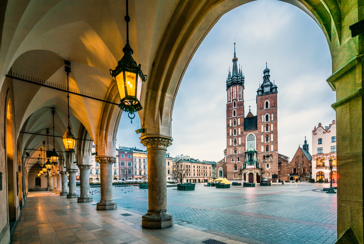 Krakow Poland The iconic St. Mary's Basilica in Krakow, seen through an arched passageway, stands as a testament to Poland's rich architectural heritage.