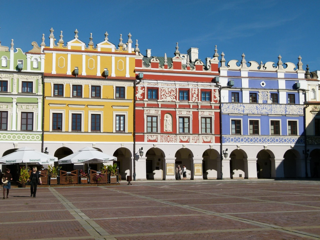 Zamosc Poland The colorful Renaissance buildings of the Zamość Market Square, showcasing the beautiful architectural styles found in Poland.