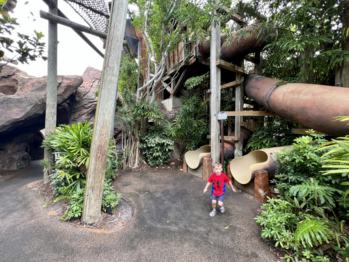 A toddler standing in front of a playground at islands of adventure universal studios, enjoying the playful and interactive attractions designed for toddlers at Universal Studios Orlando.
